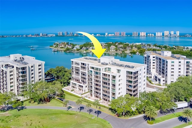 birds eye view of property with a water view