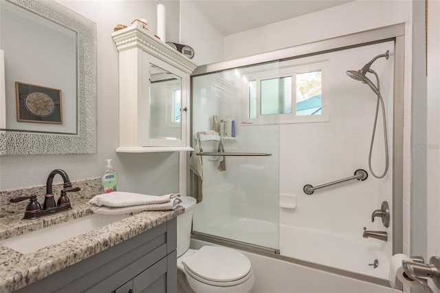 full bathroom featuring vanity, toilet, and enclosed tub / shower combo