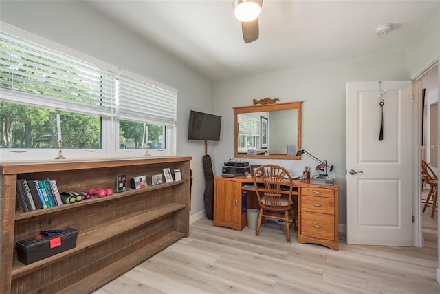 home office featuring ceiling fan and light hardwood / wood-style floors