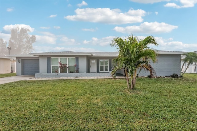 single story home with a garage and a front lawn