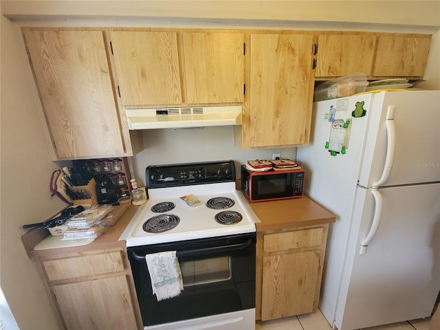 kitchen featuring white appliances, light brown cabinetry, and light tile patterned floors