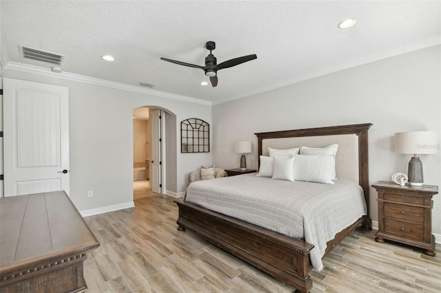 bedroom featuring light hardwood / wood-style flooring, ceiling fan, and ornamental molding