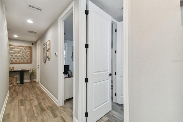 hall featuring light hardwood / wood-style flooring