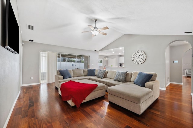 living room featuring dark hardwood / wood-style floors, ceiling fan, and lofted ceiling