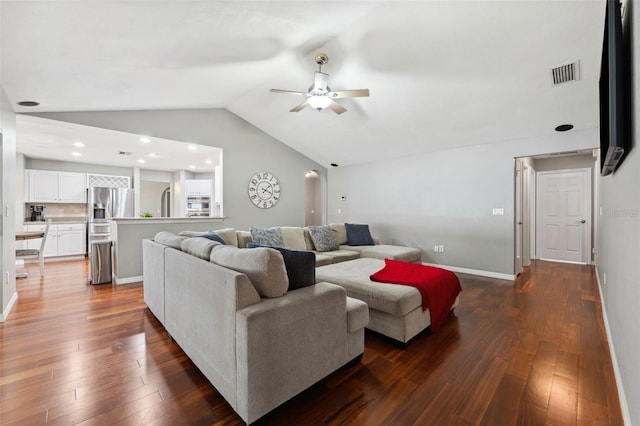 living room with dark hardwood / wood-style floors, vaulted ceiling, and ceiling fan