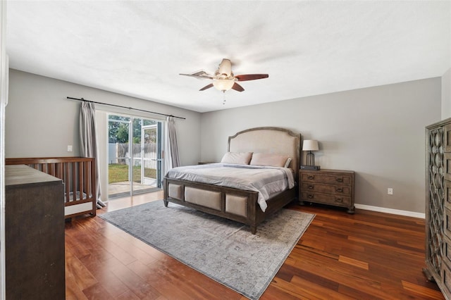 bedroom featuring ceiling fan, dark wood-type flooring, and access to outside