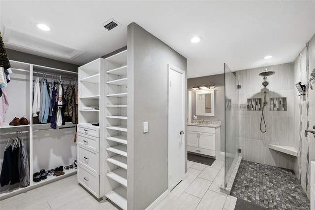 walk in closet featuring sink