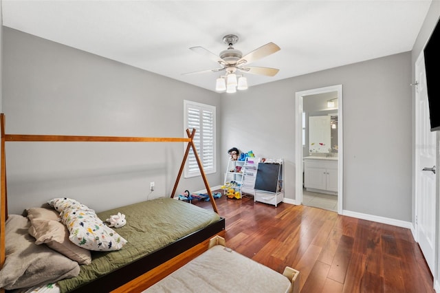 bedroom with ensuite bathroom, ceiling fan, and dark hardwood / wood-style floors