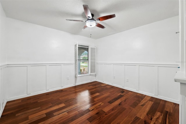 spare room with ceiling fan, dark hardwood / wood-style flooring, and a textured ceiling