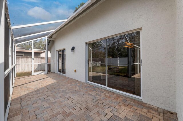 view of patio with a lanai