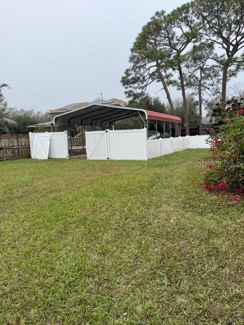 view of yard featuring a carport