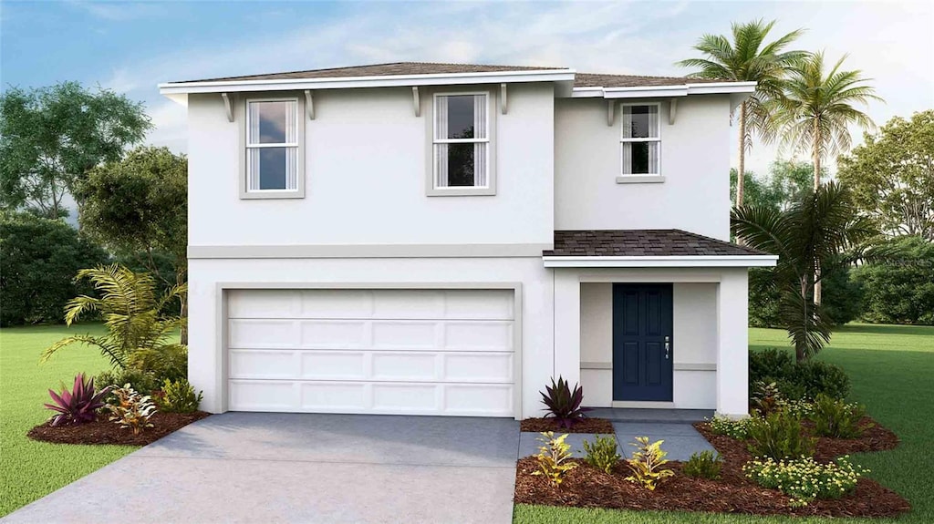 view of front facade with a front yard and a garage