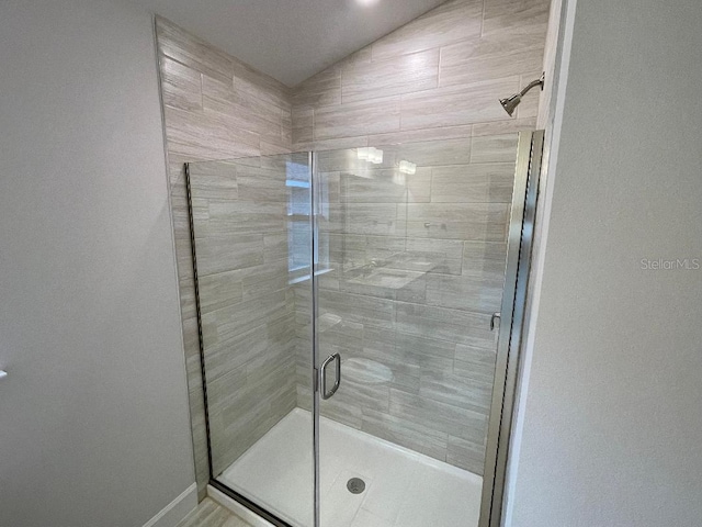 bathroom featuring an enclosed shower