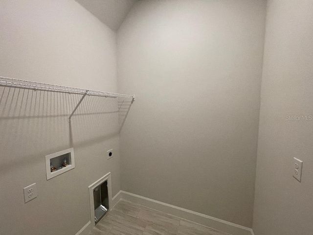 clothes washing area featuring hookup for an electric dryer and washer hookup