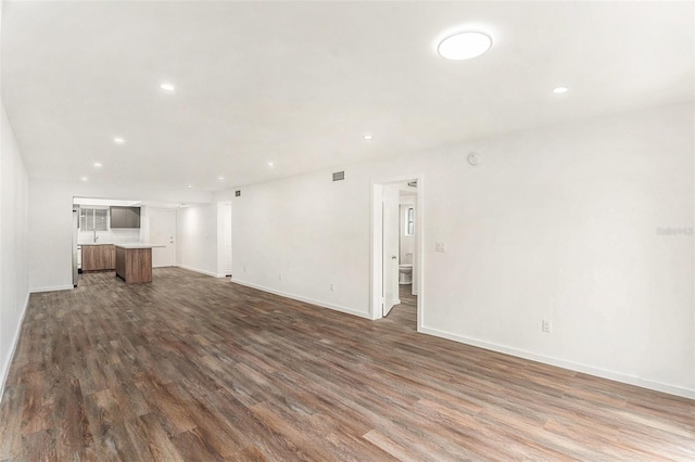 unfurnished living room featuring hardwood / wood-style floors