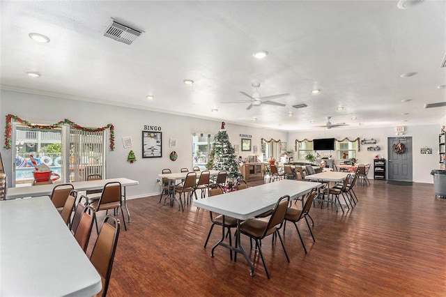 dining area with crown molding, dark hardwood / wood-style floors, and ceiling fan