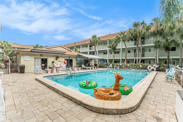 view of swimming pool with a patio area