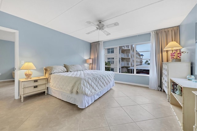 tiled bedroom with ceiling fan