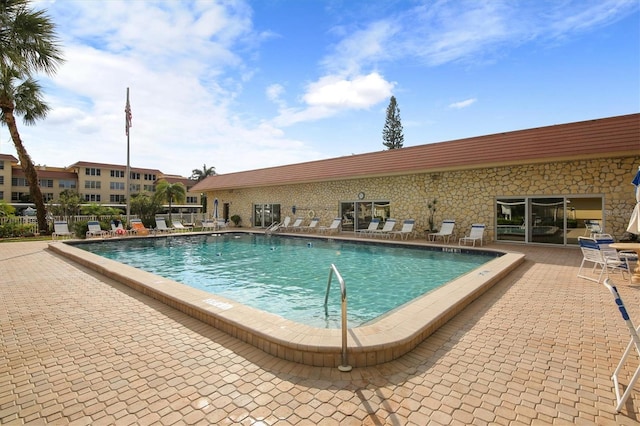 view of pool featuring a patio area