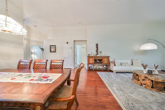 dining area with dark hardwood / wood-style floors