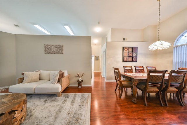 dining space featuring wood-type flooring