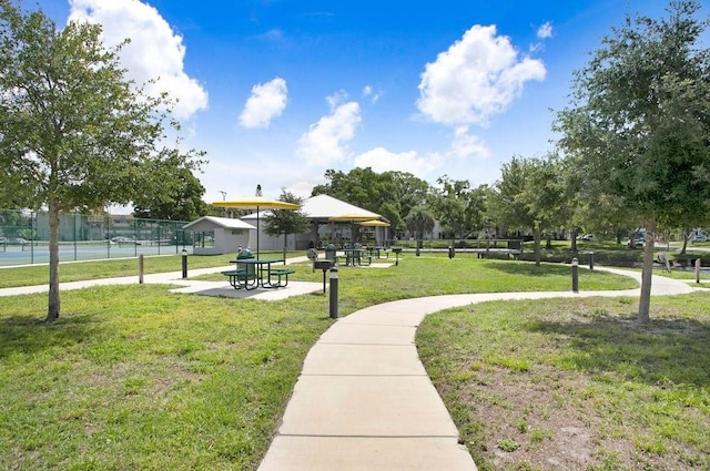 view of property's community with a lawn and a gazebo