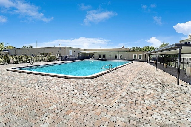 view of swimming pool featuring a patio