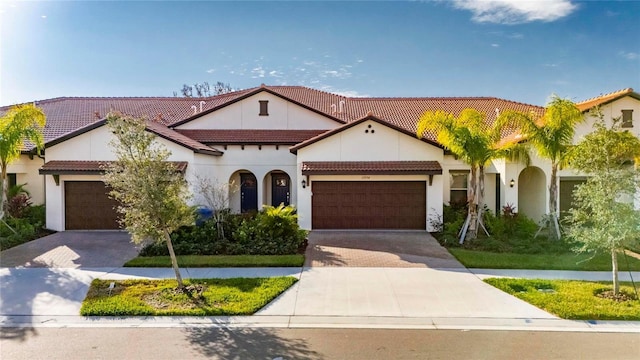 mediterranean / spanish house featuring a garage