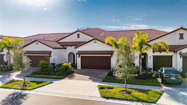 mediterranean / spanish-style house featuring a garage