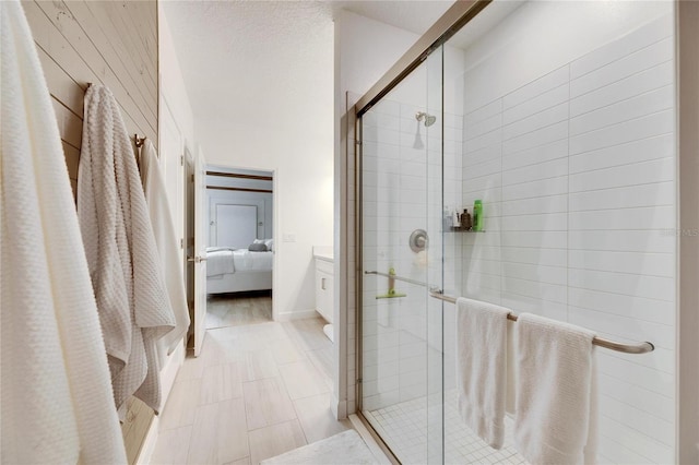 bathroom featuring a shower with shower door