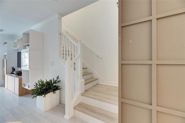 stairway with crown molding