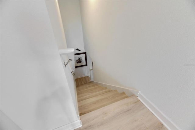 staircase featuring hardwood / wood-style floors