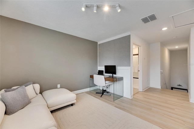 office area with light hardwood / wood-style flooring