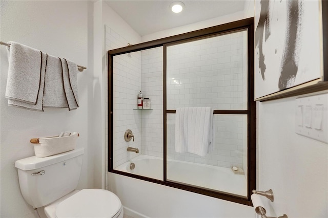 bathroom featuring toilet and enclosed tub / shower combo