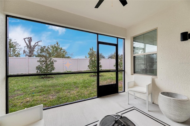 sunroom featuring ceiling fan