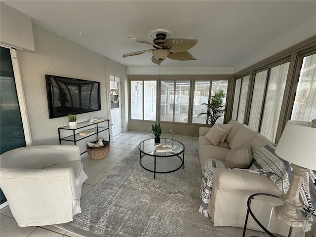 tiled living room with ceiling fan