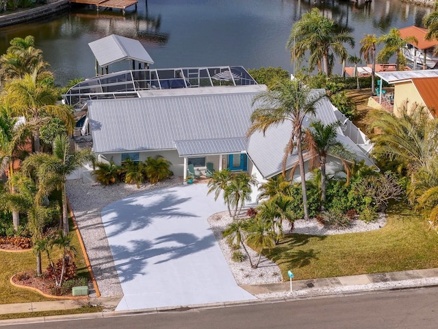 birds eye view of property with a water view