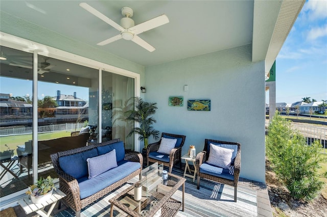 view of patio with outdoor lounge area and ceiling fan