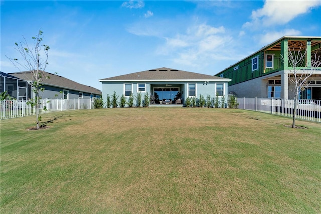 rear view of house with a yard