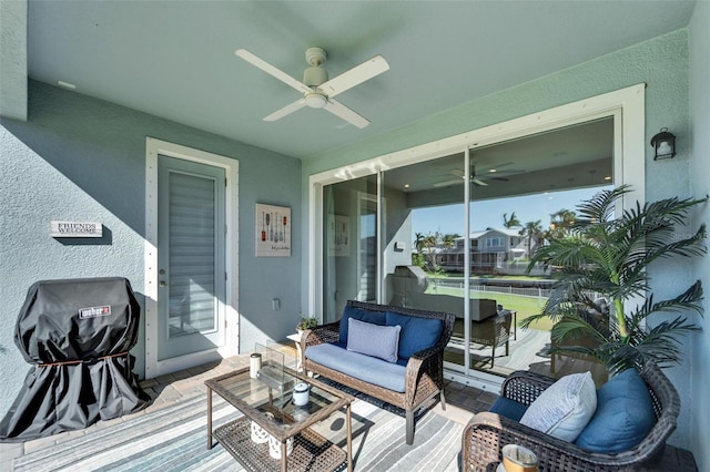 wooden deck featuring area for grilling, a patio area, outdoor lounge area, and a ceiling fan