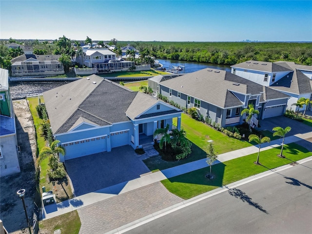 bird's eye view featuring a residential view and a water view