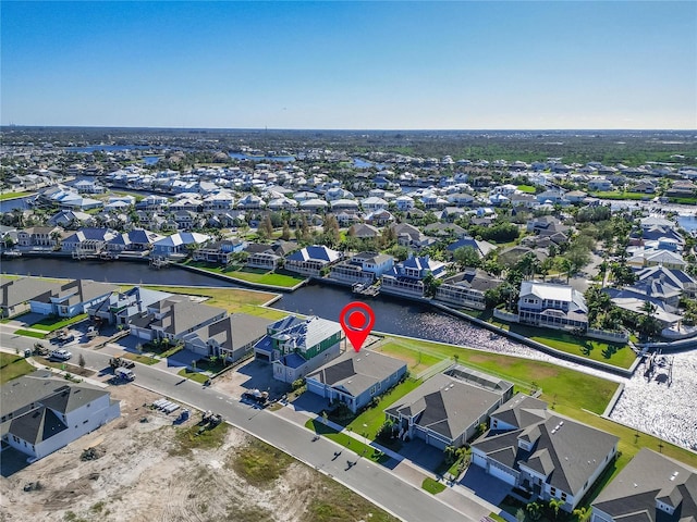 bird's eye view featuring a water view and a residential view