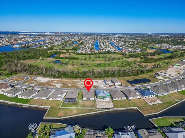 drone / aerial view featuring a water view and a residential view