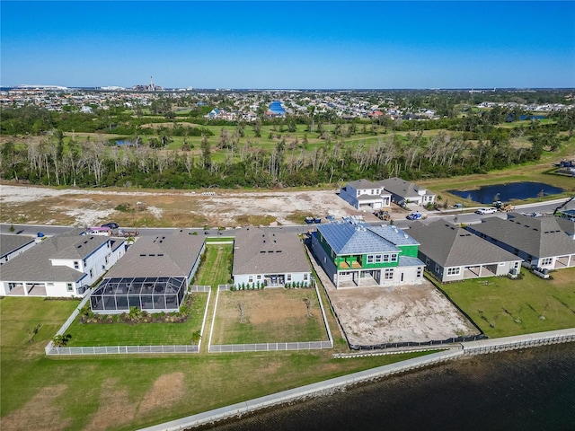 birds eye view of property featuring a residential view and a water view