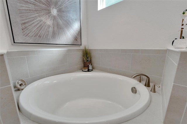 bathroom featuring a tub to relax in