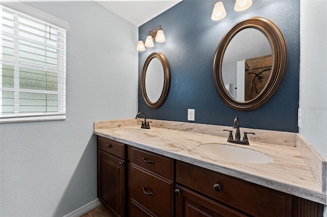 bathroom with a wealth of natural light and vanity