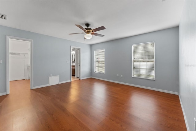 unfurnished room featuring ceiling fan and hardwood / wood-style floors