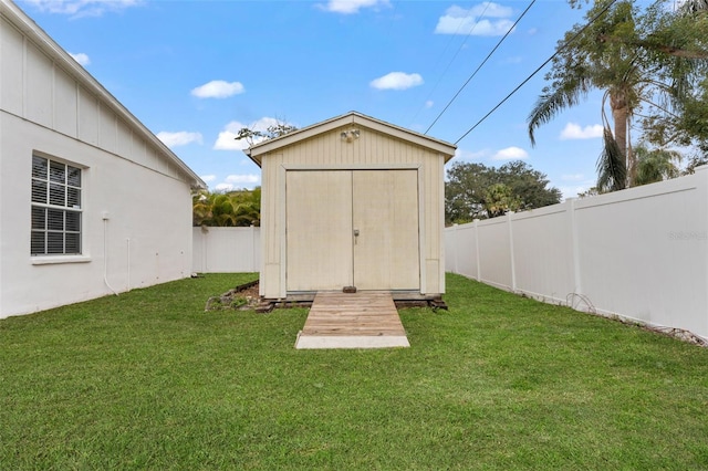 view of outdoor structure with a lawn