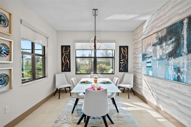 17702 Cresswind Ter, Bradenton, FL 34211 - dining space with baseboards and light tile patterned flooring