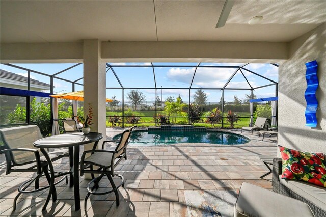 17702 Cresswind Ter, Bradenton, FL 34211 - view of patio / terrace with glass enclosure and an outdoor pool